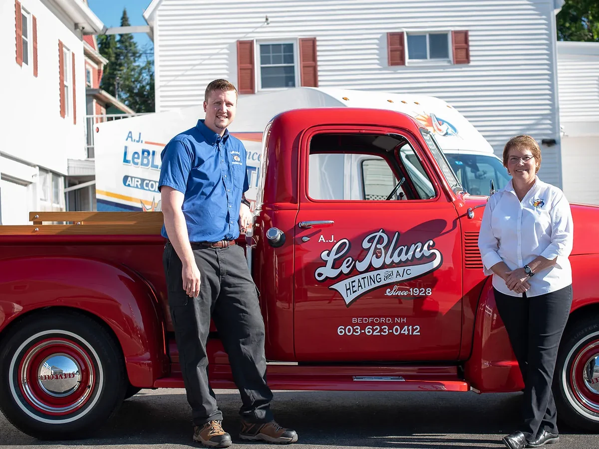 The LeBlanc family owners standing together outside A.J. LeBlanc Heating in Southern New Hampshire