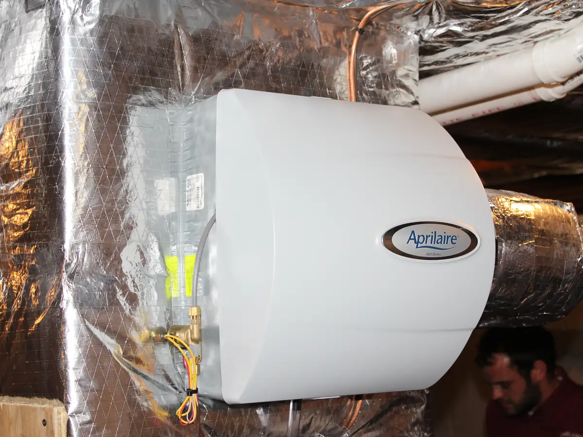 Aprilaire bypass humidifier installed on insulated supply ductwork in a Southern NH home by A.J. LeBlanc Heating