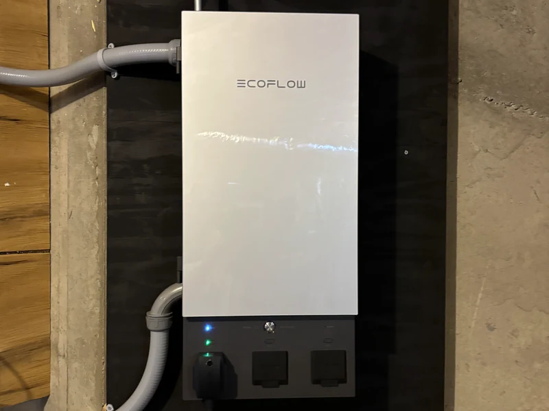 Wall-mounted whole-home battery backup with automatic transfer switch and critical-load panel installed by A.J. LeBlanc Heating in Southern NH