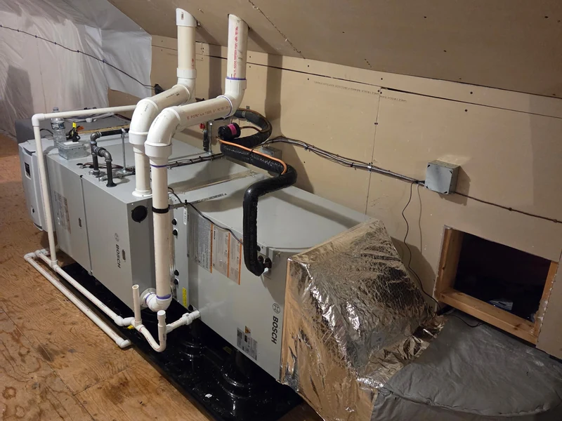 Bosch 96% AFUE condensing horizontal gas furnace installation in a Southern NH attic crawl space