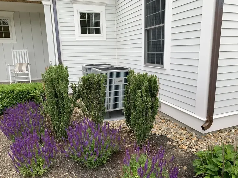 Pair of Bosch outdoor heat pump units installed by A.J. LeBlanc Heating at a Southern NH home