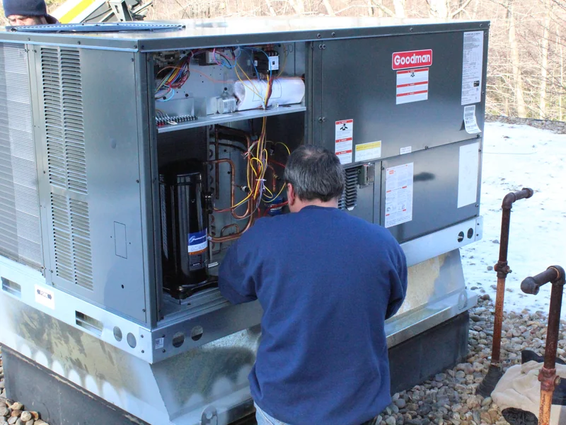 A.J. LeBlanc Heating technician working on commercial rooftop HVAC equipment