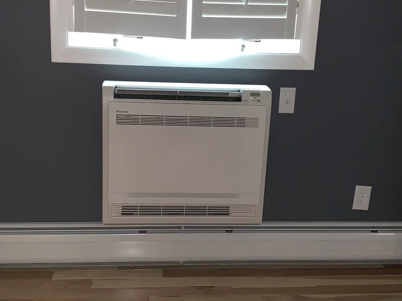 Daikin floor-mounted ductless mini split indoor unit in a Southern NH home