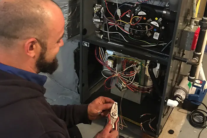 A.J. LeBlanc electrician troubleshooting furnace wiring