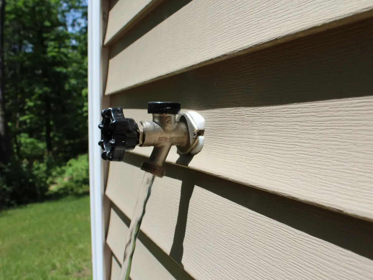 Frost-free outdoor hose bib on a New Hampshire home, protecting against frozen pipes