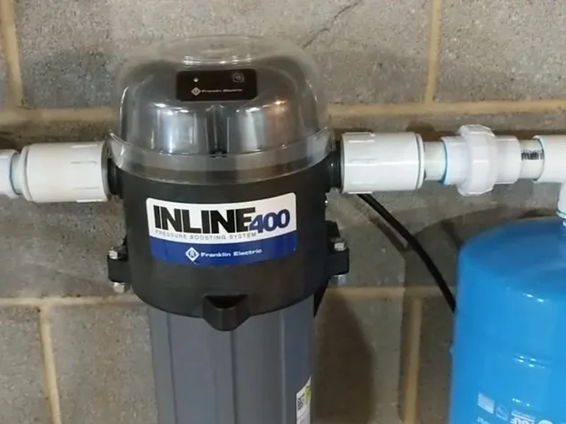 Inline residential water pressure booster pump installed on interior copper plumbing by A.J. LeBlanc Heating in Southern NH