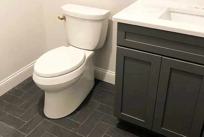 kohler toilet with rose gold flush handle