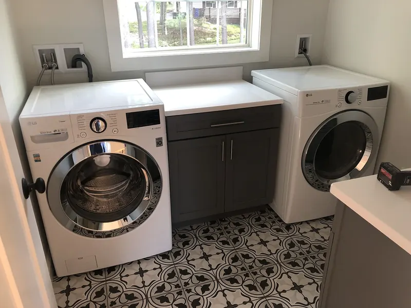 LG front-load washer and dryer hooked up by A.J. LeBlanc Heating in a Southern NH laundry room