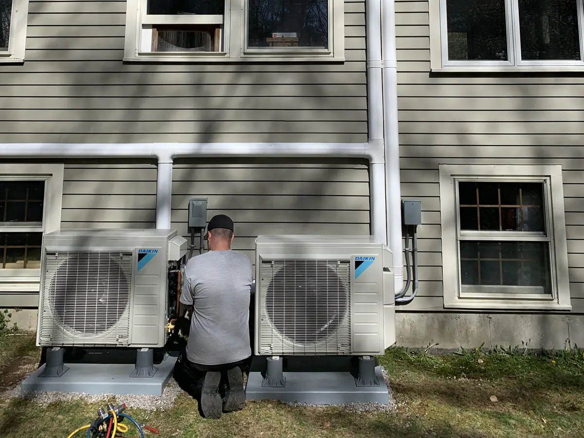 A.J. LeBlanc Heating technician servicing multi-zone Daikin mini split outdoor units in Southern NH