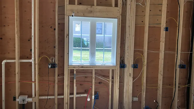 New construction wall framing with electrical and plumbing rough-in by A.J. LeBlanc Heating in Southern NH