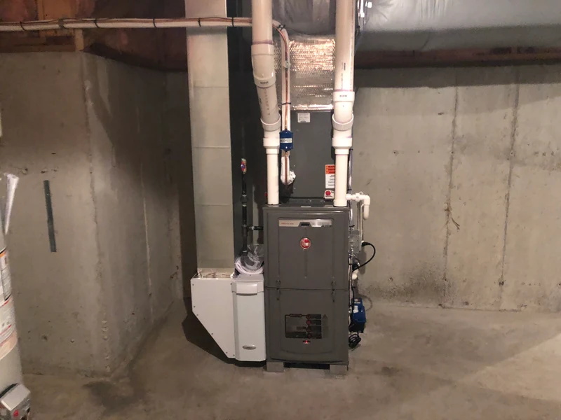 Rheem 96% AFUE condensing gas furnace with Aprilaire accessory in Southern NH