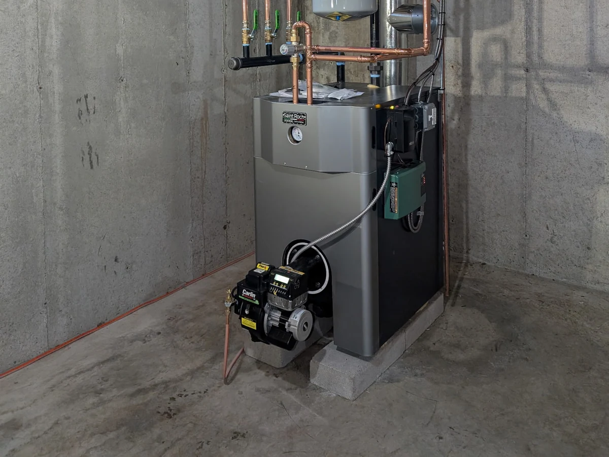 Saint Roch cast-iron oil boiler installation in a Southern NH basement, the natural successor to Biasi B-10