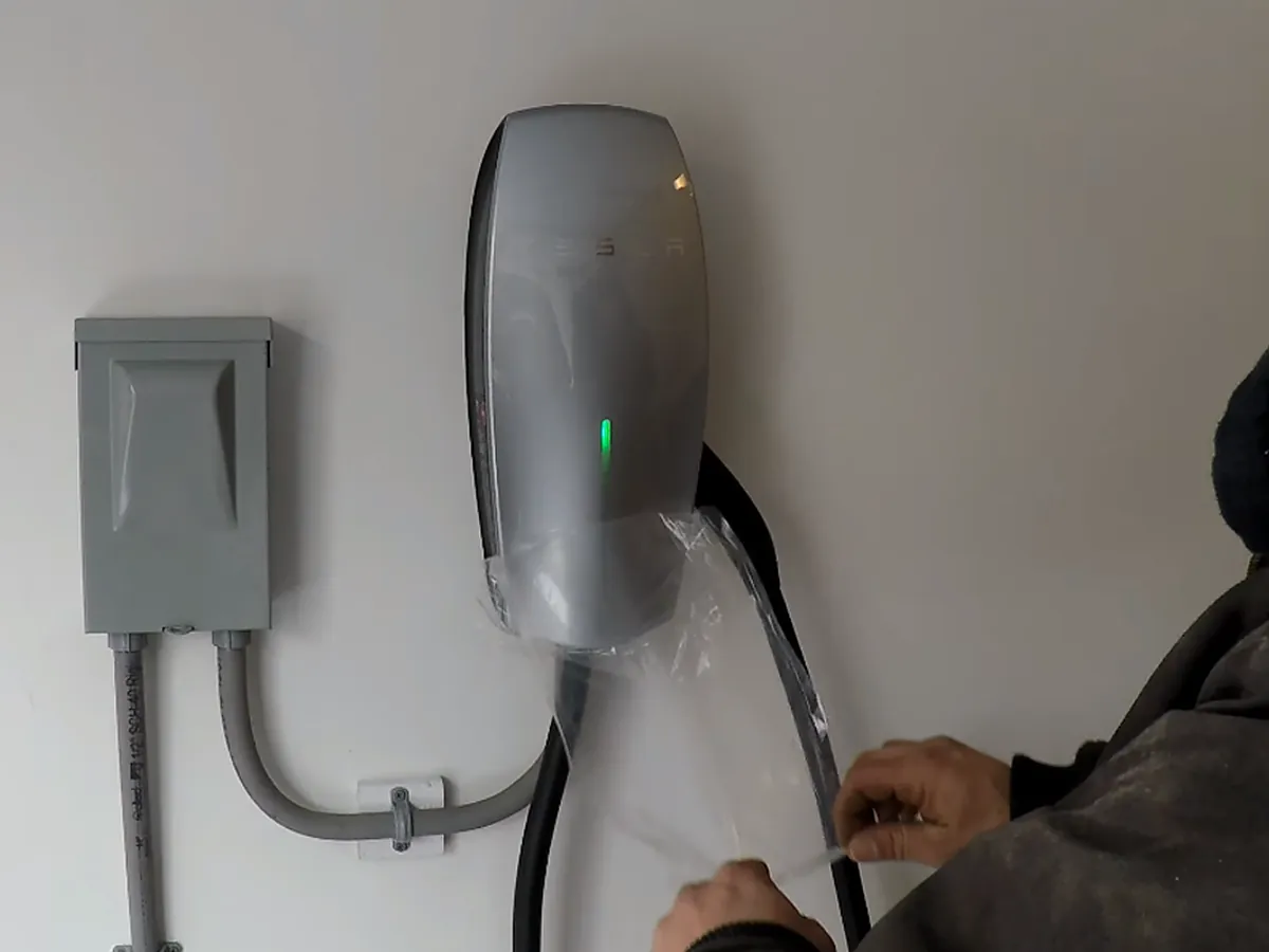 Tesla Wall Connector EV charger installation by A.J. LeBlanc Heating licensed electricians at a Southern NH home