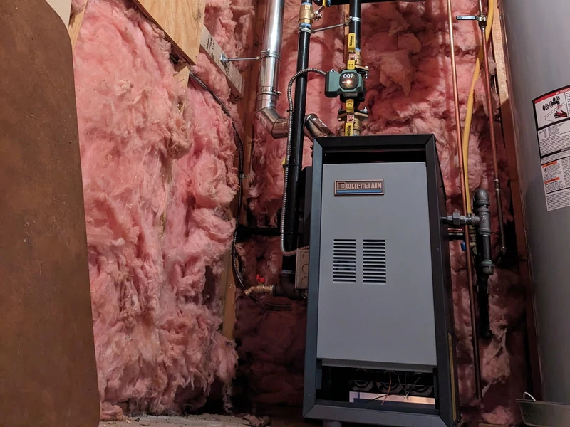 Weil-McLain gas boiler replacement with copper piping and expansion tank in a Southern NH basement